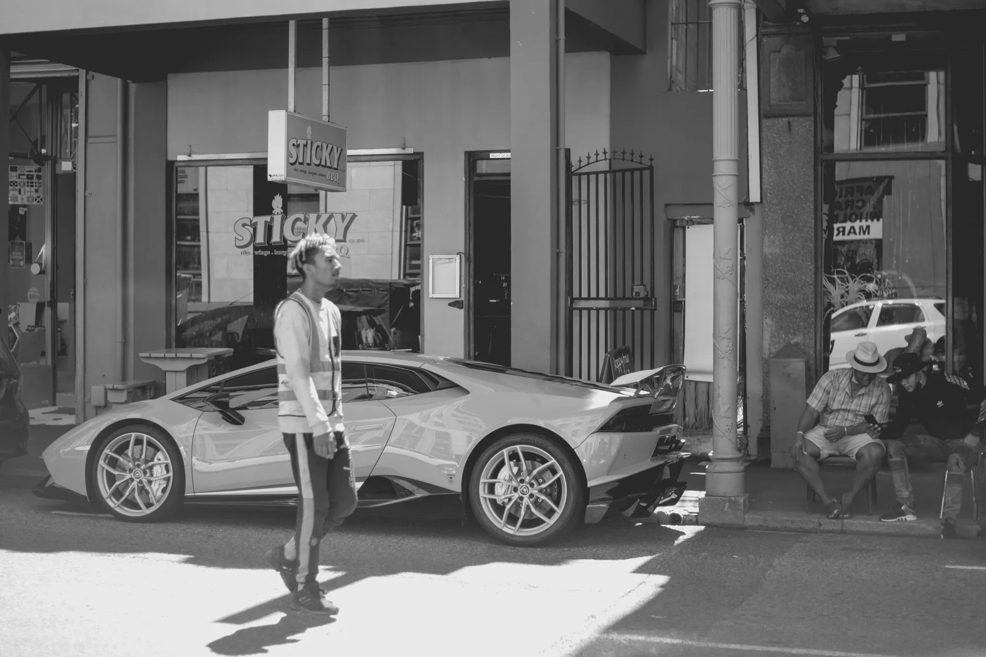 2022-02-17 - Cape Town - Person walks in front of parked lamborghini